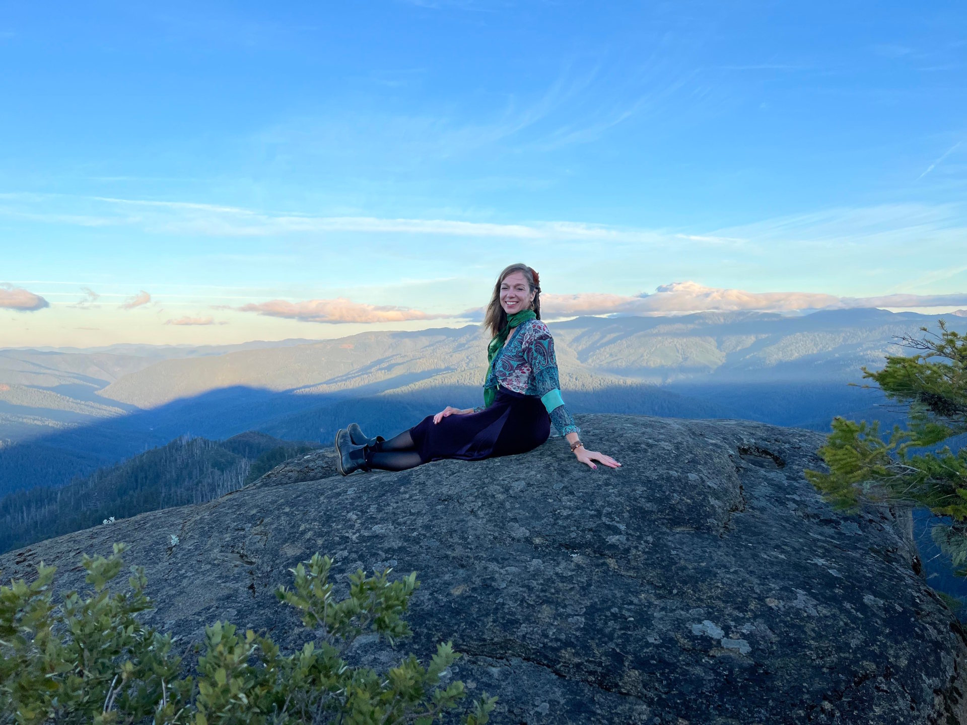 Summer Greenlees on a mountain top enjoying the view.