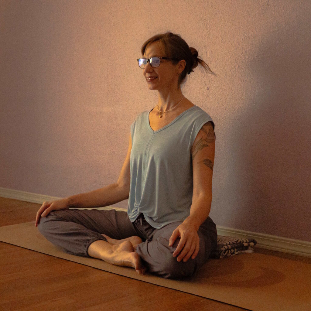 Summer Greenlees in lotus pose